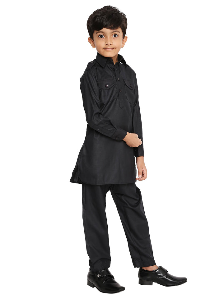Kids black Pathani set in cotton blend with long sleeves and buttoned chest pockets, offering a stylish ethnic look for boys.