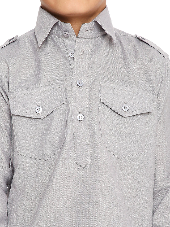 Close-up of Grey Pathani Set for Kids - Kurta Pyjama Set highlighting buttoned flap pockets and fine stitching on wrinkle-free poly blend fabric.