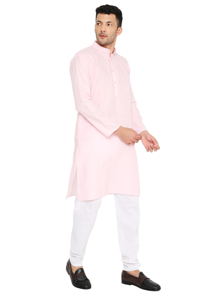 Model adjusting sleeve of Magic Cotton Kurta - Light Pink, showcasing its soft cotton texture and stylish mandarin collar.
