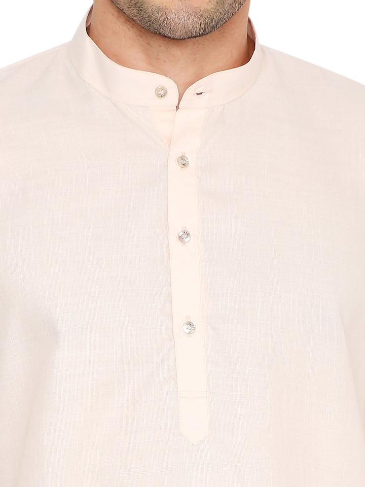 Close-up of Magic Cotton Peach Kurta's button placket and mandarin collar, emphasizing fine stitching and premium cotton fabric.