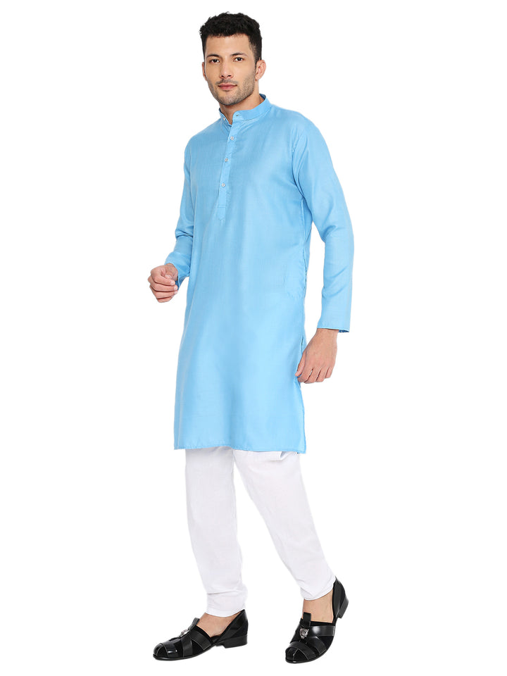 Side pose of Magic Blue Cotton Kurta paired with white bottoms, highlighting its versatile design and comfortable cotton fabric.