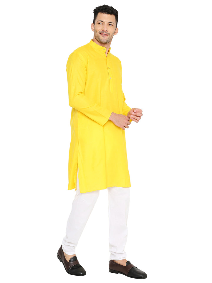 Side pose of yellow magic cotton kurta paired with white pajama, highlighting its comfortable fit and versatile design.