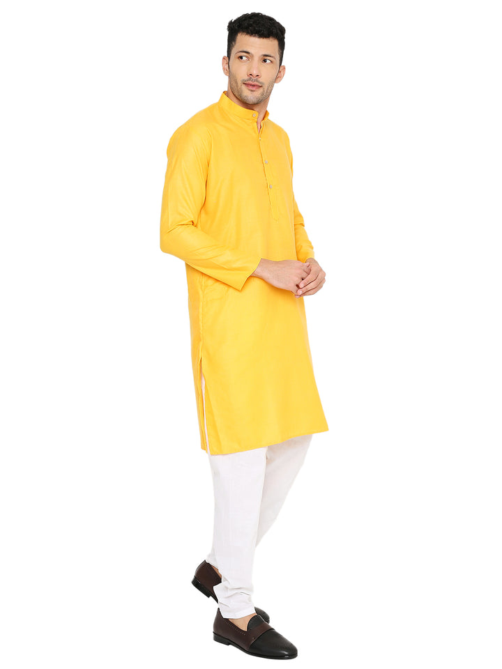 Angled view of Magic Cotton Kurta Yellow paired with white bottoms, showcasing its vibrant color and elegant silhouette.