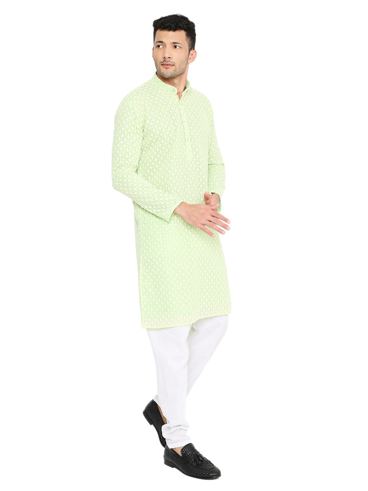 Mint green festive kurta in soft georgette with sequin detailing, styled for traditional events with a modern ethnic look.