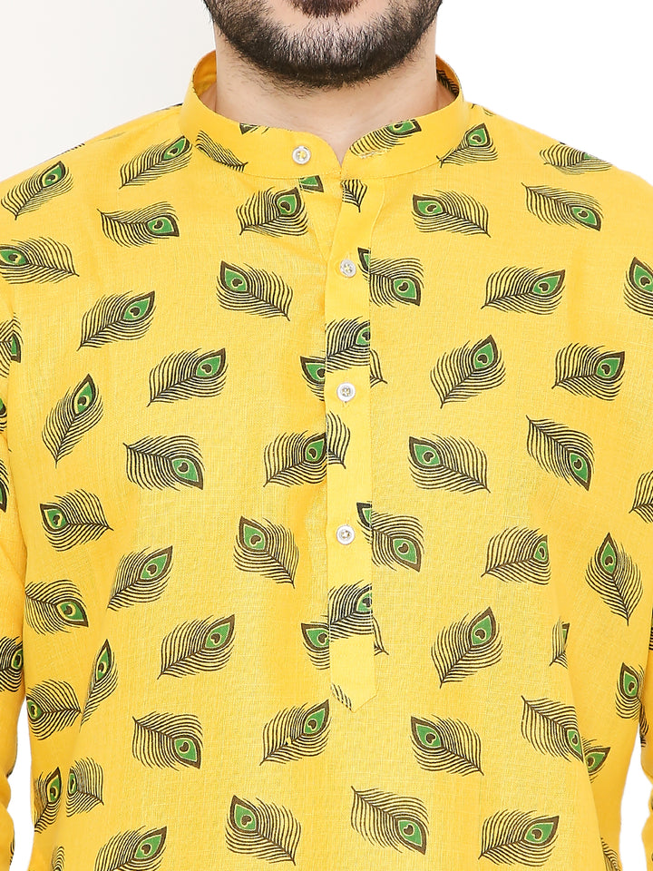 Close-up of yellow Janmashtami Kurta with detailed peacock feather prints and mandarin collar, highlighting Krishna-themed festive style.
