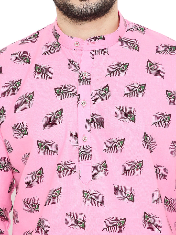 Close-up of Magic Cotton Janmashtami Kurta in pink, highlighting detailed peacock feather prints symbolizing Krishna's leelas.