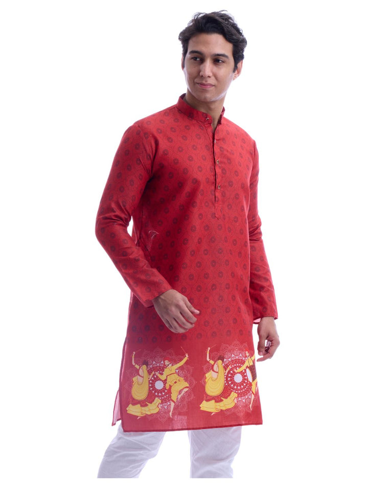 Angled front view of red Navratri kurta pyjama set with traditional dandiya artwork, ideal for festive and cultural events.