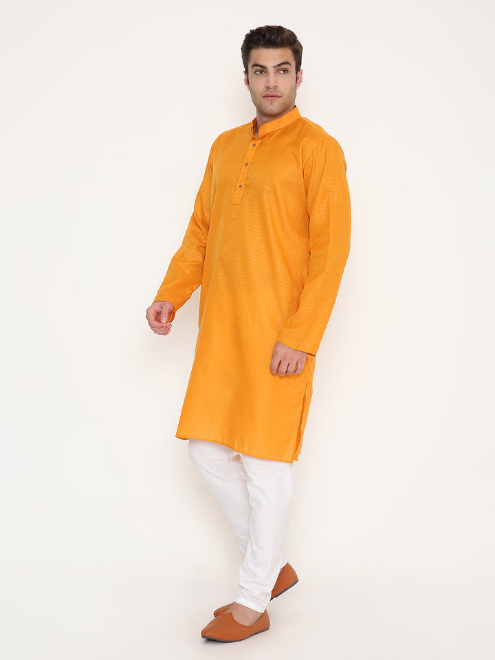 Versatile Mustard Kurta with ethnic pattern and side slits, paired with white bottoms for a complete traditional outfit.
