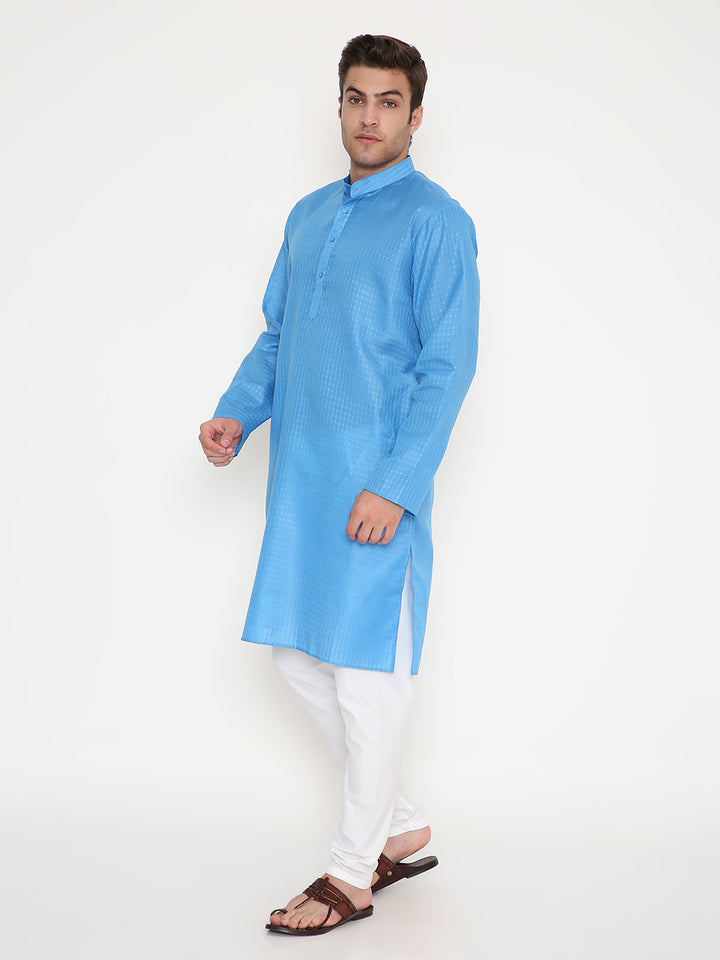 Side pose of men's blue regular fit kurta set with white churidar, designed for comfort and elegance in festive and ceremonial settings.