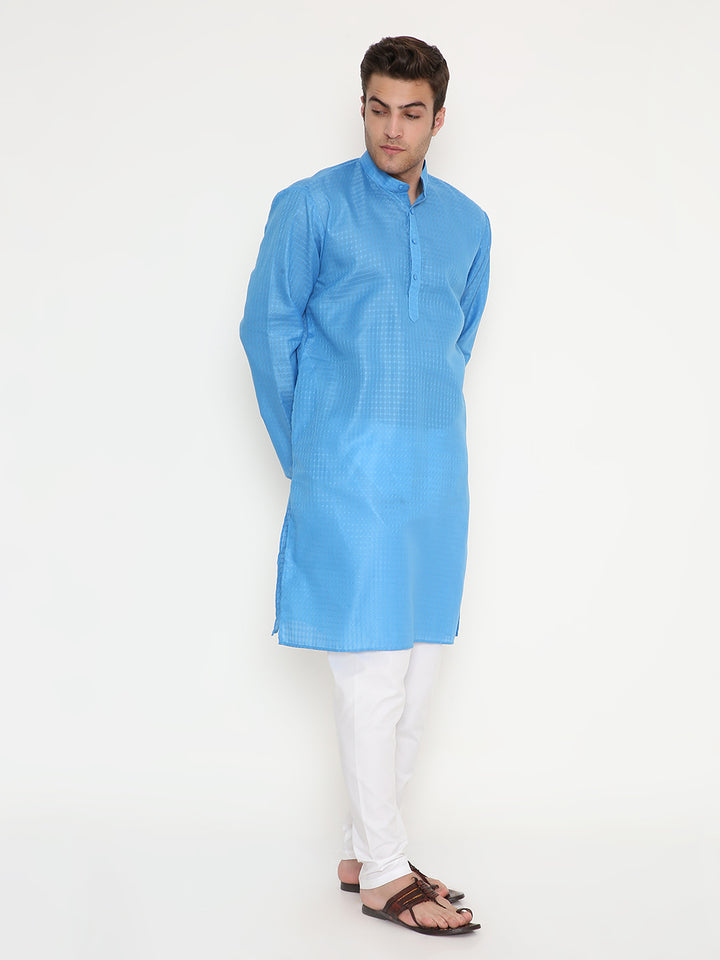 Men's blue ethnic kurta with textured pattern and relaxed fit, paired with white bottoms for a versatile traditional outfit.
