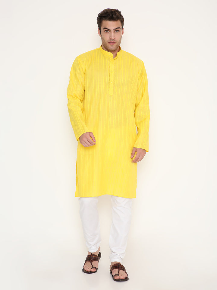 Yellow Kurta Poly Viscose in regular fit with self design, styled with white churidar for traditional occasions. Comfortable and easy-care fabric.