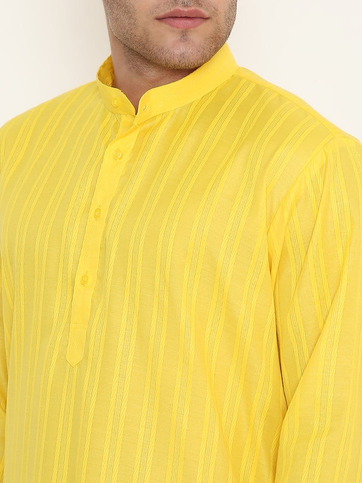 Close-up of Yellow Kurta Poly Viscose fabric texture and buttoned neckline, featuring fine self design. Durable and easy to maintain.