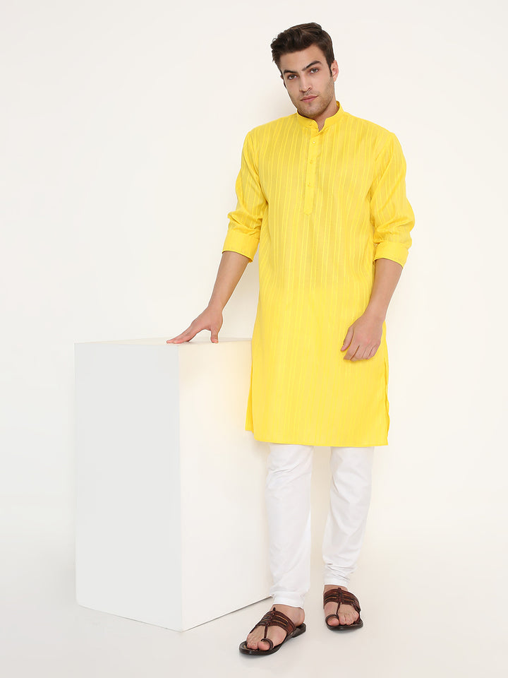 Model poses in Yellow Kurta Poly Viscose with rolled sleeves, showing off its elegant self design and relaxed fit. Great for traditional gatherings.