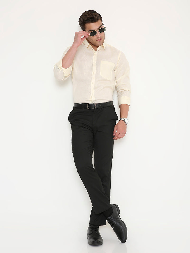 Full body view of Slim Fit Beige Men's Shirt - Poly Viscose styled with black trousers, ideal for professional and event-ready outfits.