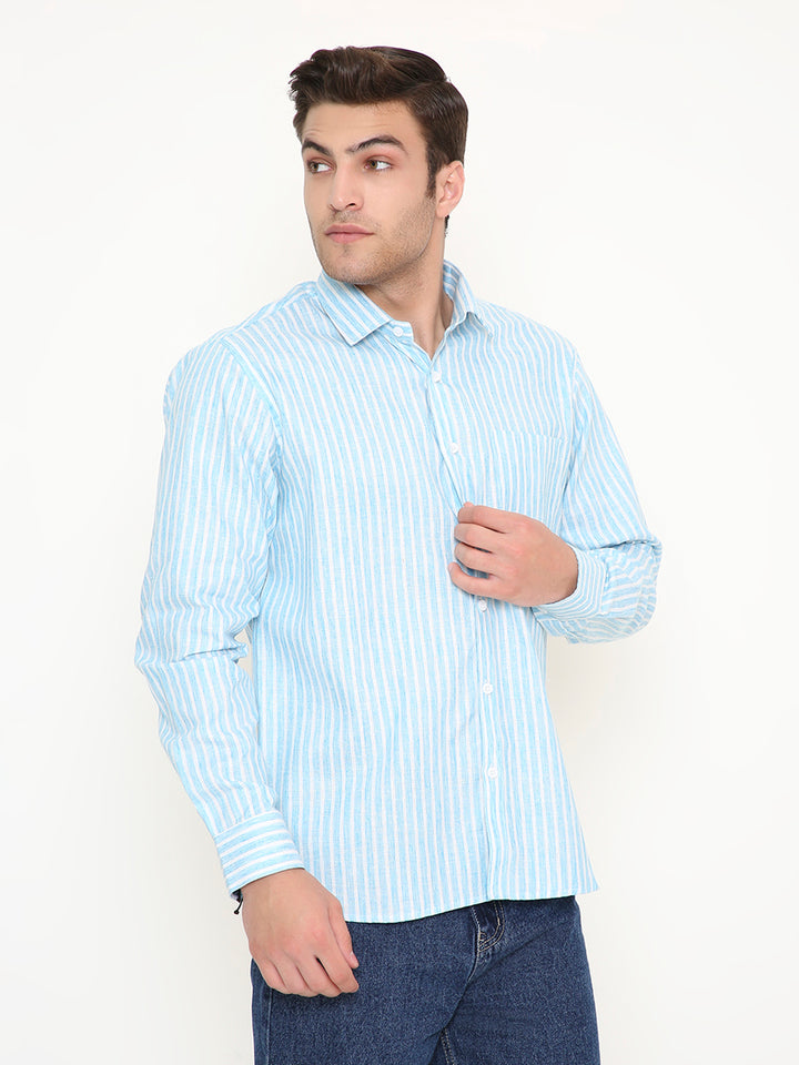 Model adjusting Slim Fit Striped Shirt - Men's Sky Blue Wear, showcasing button-down front and modern slim silhouette.