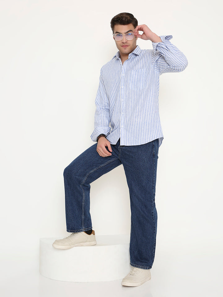 Full body view of man wearing Dark Blue Slim Fit Striped Shirt paired with jeans and white shoes, ideal for modern casual style.