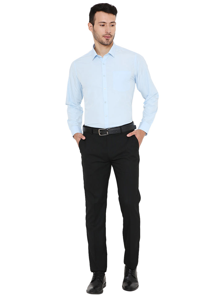 Full body view of model wearing Maharaja Slim Fit Formal Shirt in light blue paired with black trousers, ideal for business settings.