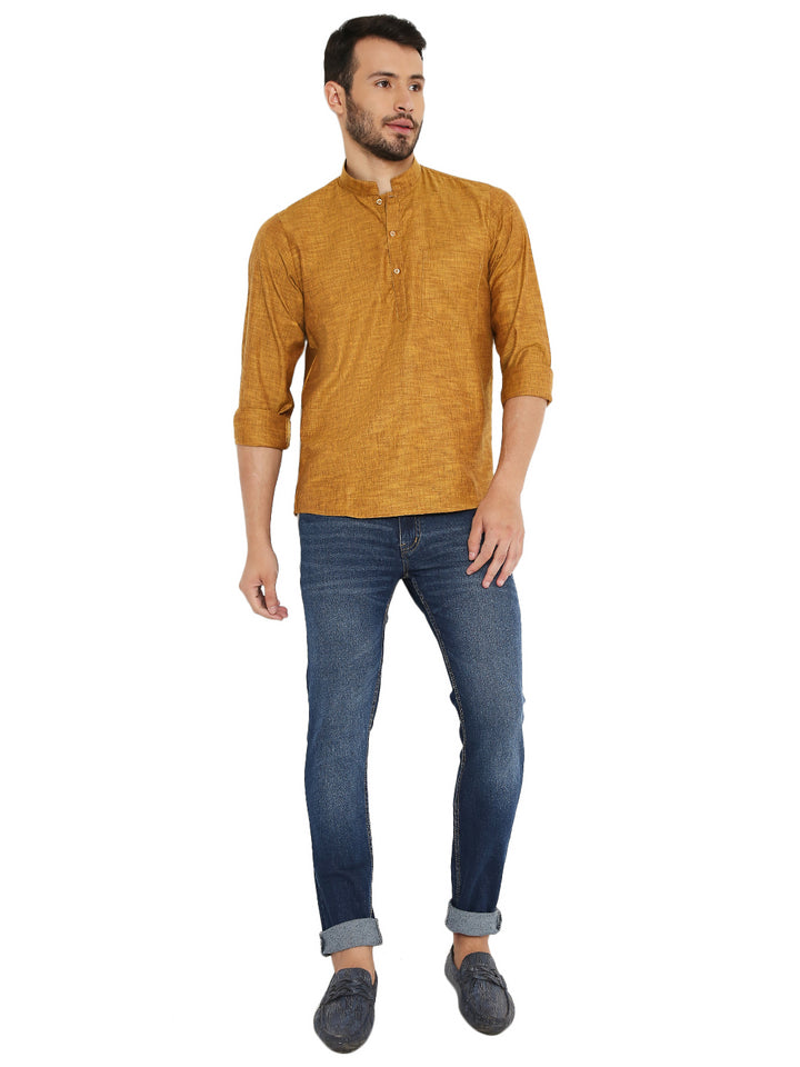 Full body view of model wearing yellow linen kurta with jeans, blending traditional Maharaja style with modern casual fashion.