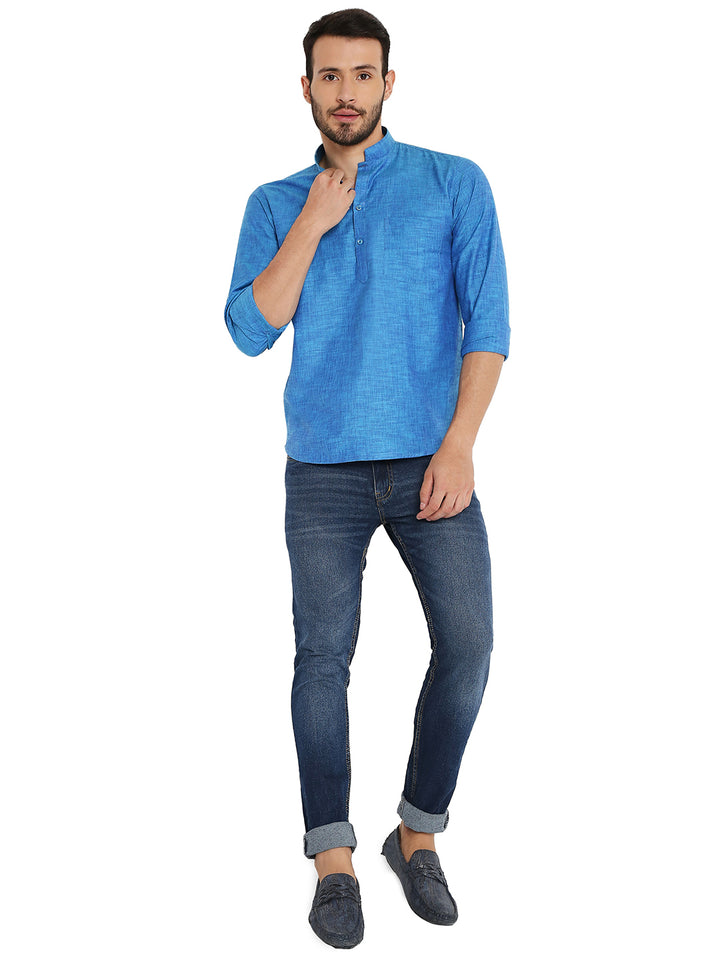 Full-body view of man wearing Blue Linen Short Kurta paired with jeans, showcasing a modern ethnic look for summer.