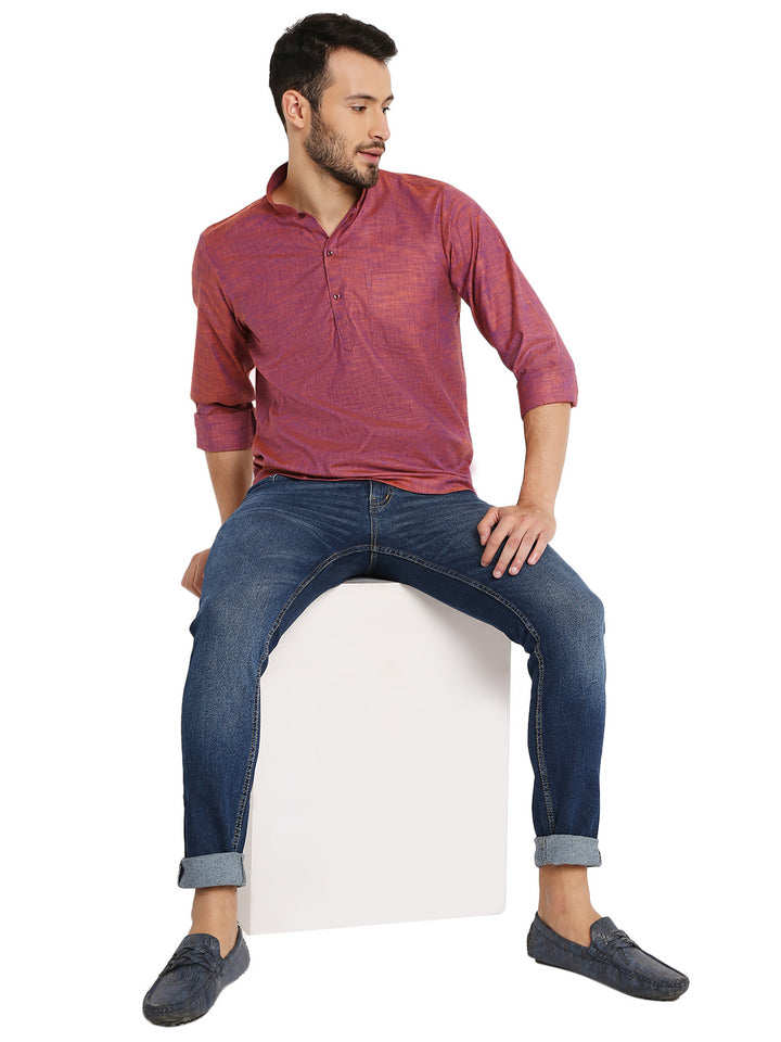Model seated wearing Maharaja Classic Linen Kurta Pink with jeans, perfect blend of casual and ethnic summer fashion.