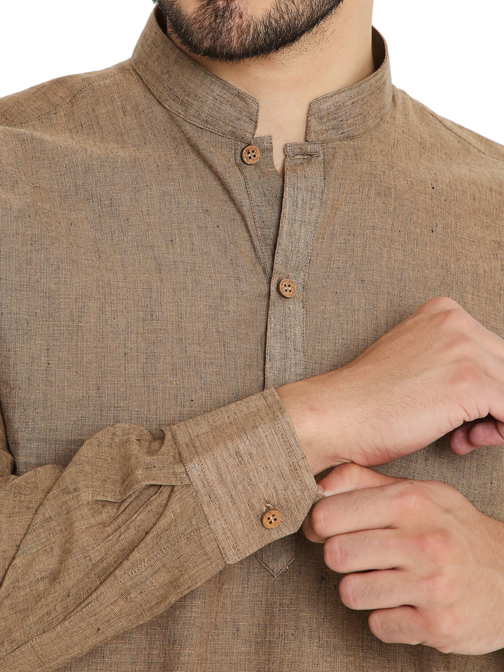 Close-up of brown Handloom Cotton Kurta's wooden buttons and textured fabric, highlighting craftsmanship and breathable design.