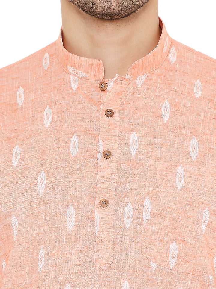 Close-up of Linen Kurta Peach - Summer Comfort, showing wooden buttons, chest pocket, and fine ikat detailing.