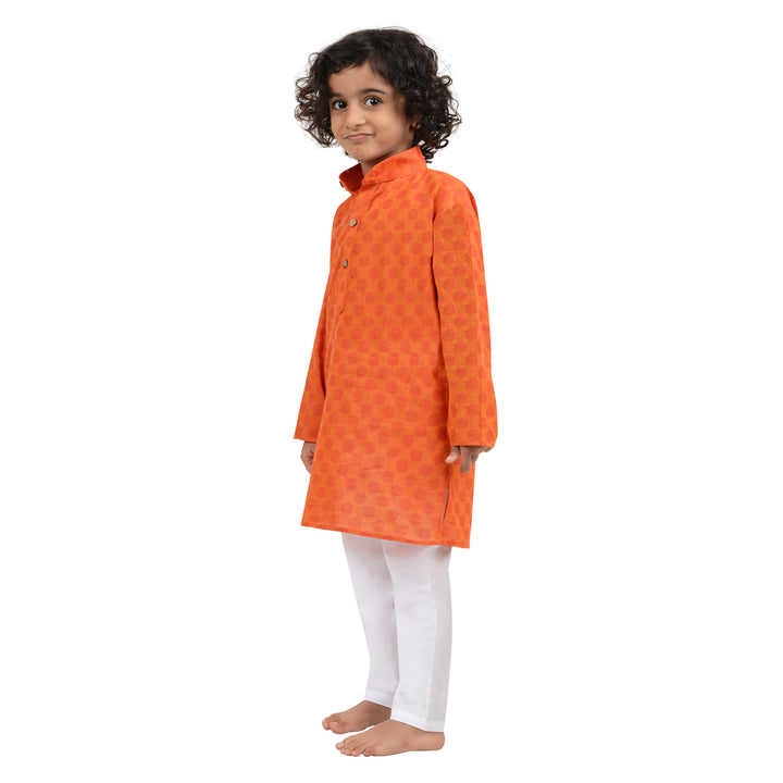 Side view of Boys Handloom Cotton Kurta in Dark Orange paired with white pyjama, showcasing comfort and ethnic style.