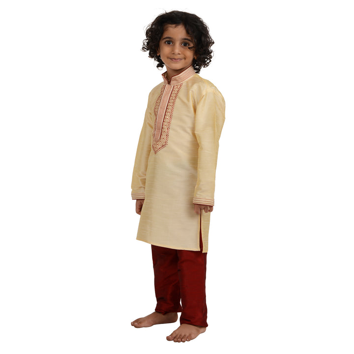 Side view of Kids Gold Embroidered Kurta Set in art silk, showcasing traditional festive wear for boys with red pants.