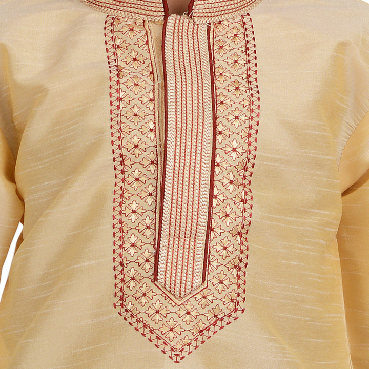 Close-up of intricate red embroidery on the neckline of the Kids Gold Embroidered Kurta Set in art silk fabric.
