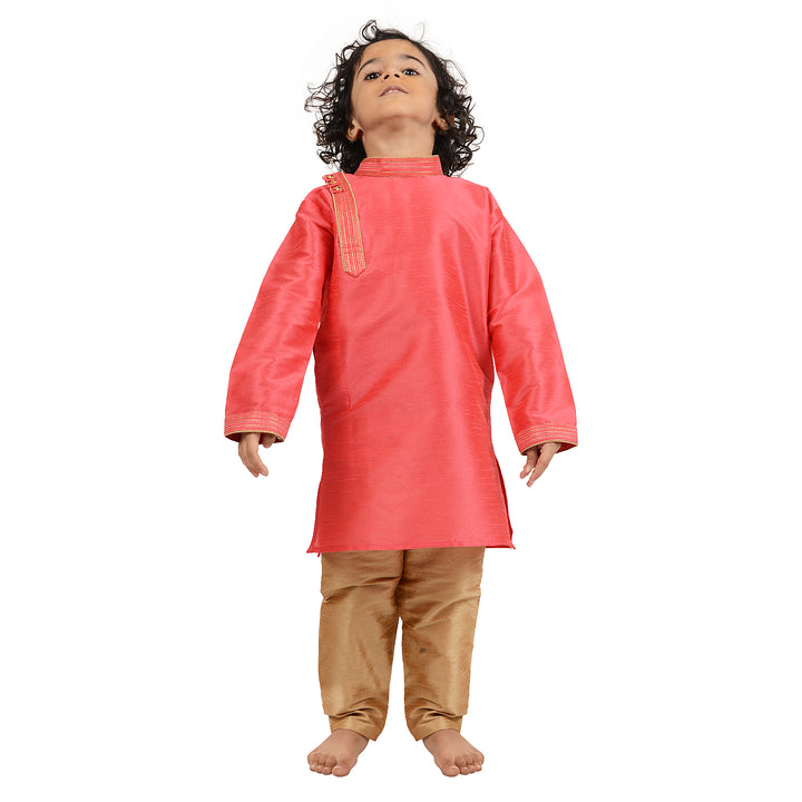 Front view of child wearing Art Silk Pink Kurta with golden churidar, designed for comfort and festive elegance.
