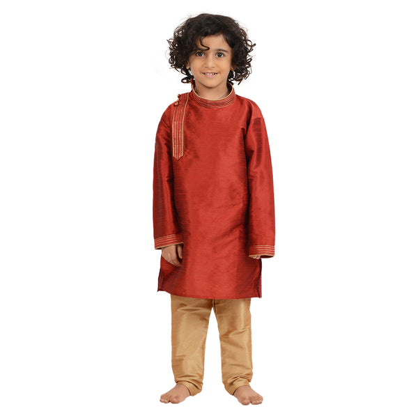 Red Art Silk Kids Kurta Set - Maharaja featuring a boy in a red side-button kurta and beige churidar, ideal for festive and traditional wear.