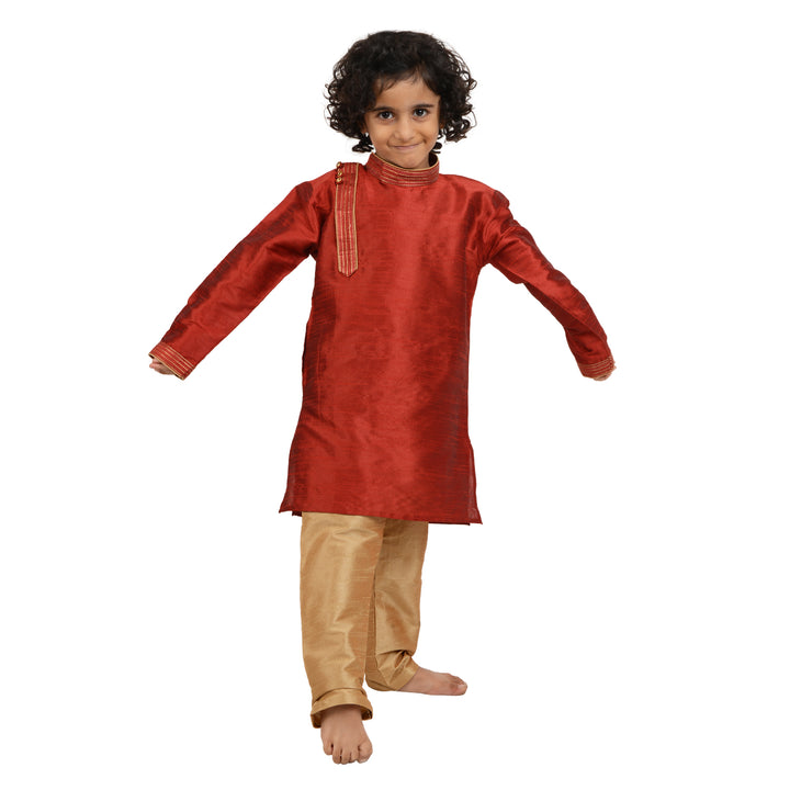 Red Art Silk Kids Kurta Set - Maharaja with a boy in motion, emphasizing the kurta's flexibility and stylish ethnic appeal for boys.