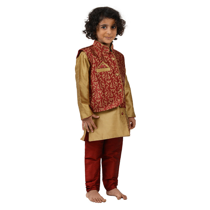 Kids traditional outfit with golden art silk kurta and red brocade jacket, designed for comfort and royal ethnic style.