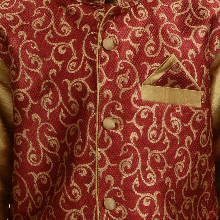 Close-up of red brocade jacket with golden swirl pattern and pocket square, part of the Art Silk Kurta Set for boys.