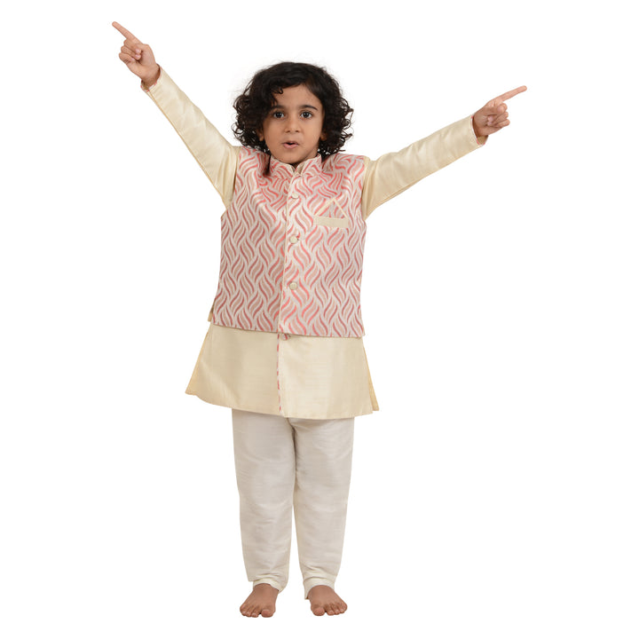 Boy wearing Art Silk Kurta with Red Jacket raising arms, showcasing playful comfort and stylish ethnic wear for kids.