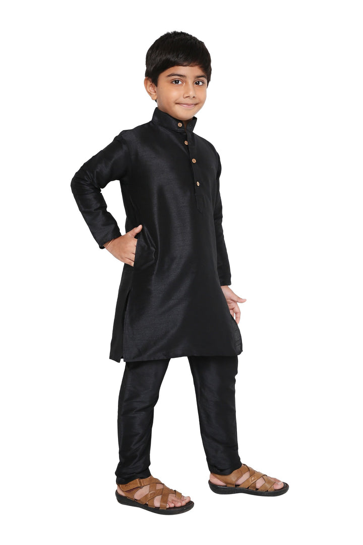 Elegant black Banarasi kurta set for boys featuring a classic silhouette and side slits, suitable for weddings and cultural events.