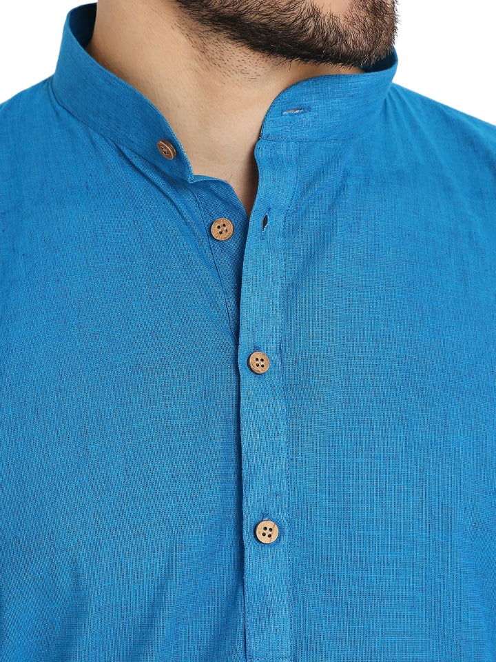 Close-up of blue handloom cotton kurta's wooden buttons and mandarin collar, highlighting fine craftsmanship and breathable fabric.