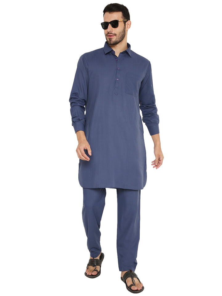 Stylish wrinkle-free Pathani set in blue, paired with sunglasses for a modern twist on traditional attire, perfect for versatile occasions.