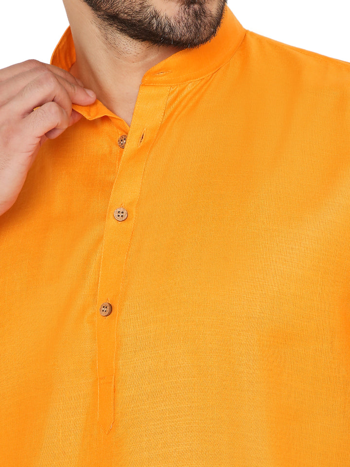 Close-up of Magic Cotton Kurta in orange, showing fine cotton weave, wooden buttons, and mandarin collar for a refined ethnic appeal.