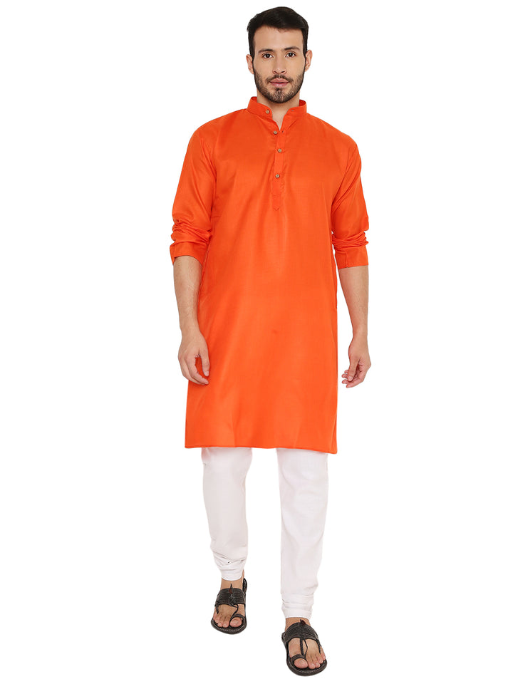 Magic Cotton Kurta in Dark Orange with rolled-up sleeves, showcasing its flexible styling for both casual and festive settings.