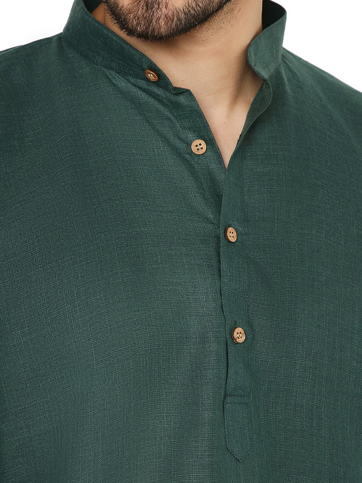 Close-up of the green Magic Cotton Kurta's textured fabric and wooden buttons, highlighting its fine detailing and easy-care material.