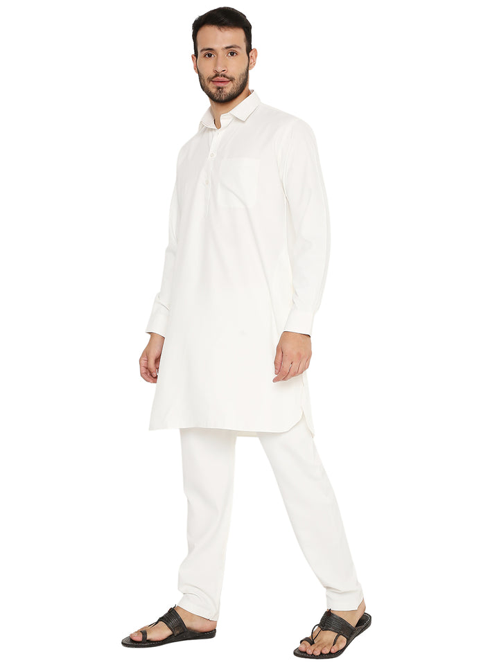 Off-white wrinkle-free poly blend Pathani kurta set styled for comfort and elegance, perfect for festive and ceremonial occasions.