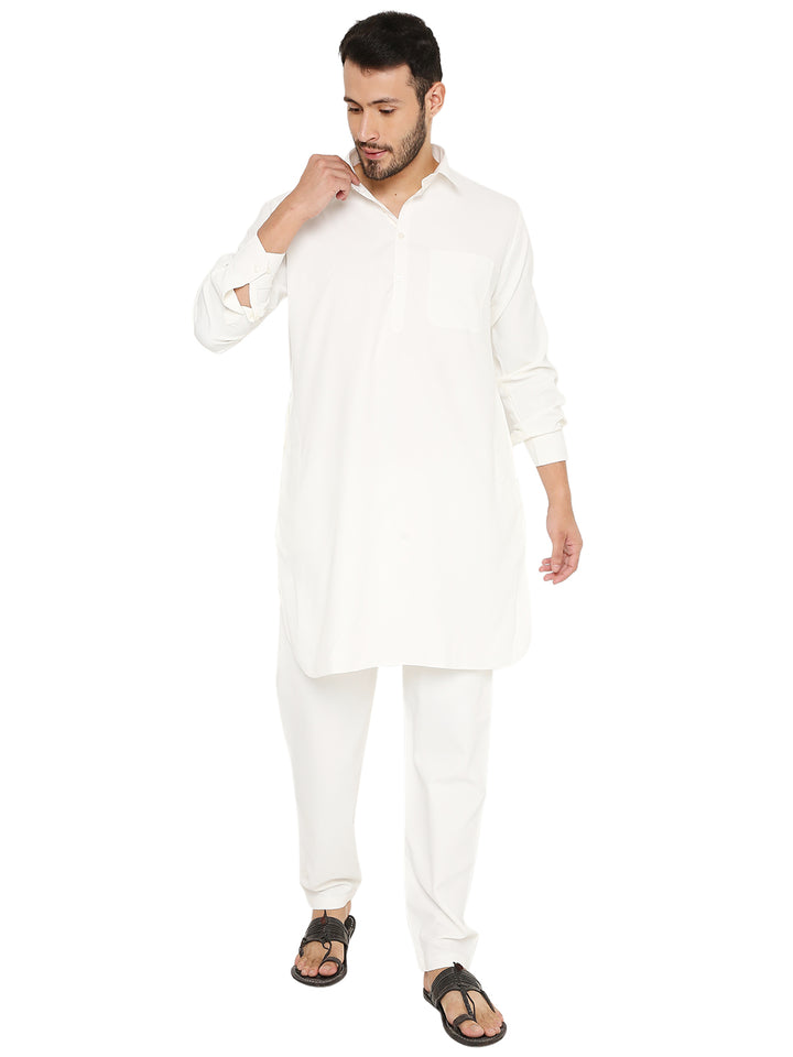Stylish wrinkle-free Pathani kurta set in off-white poly blend with buttoned neckline and relaxed fit, ideal for ethnic fashion.