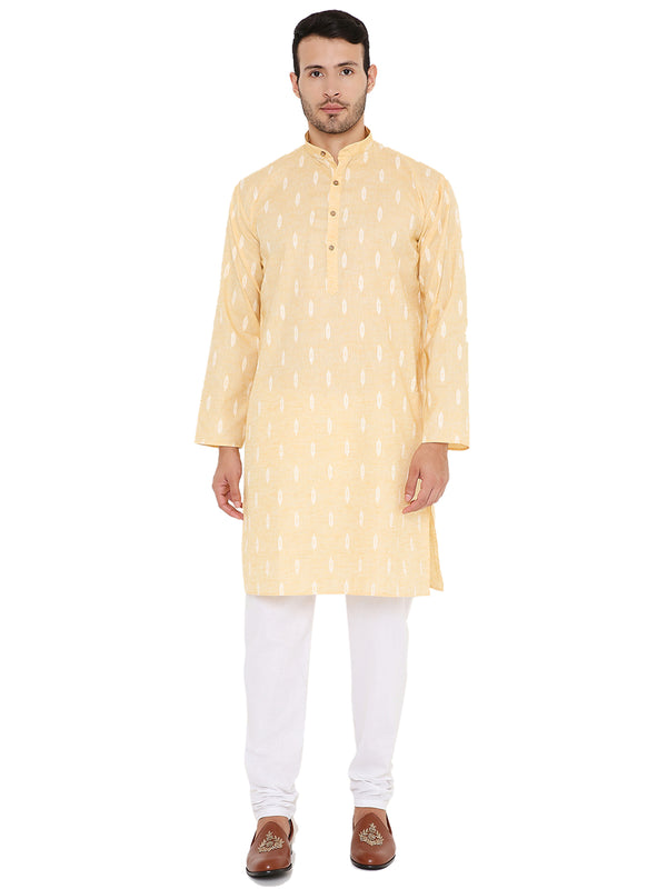 Yellow linen blend kurta set with white patterns, ideal for summer wear. Features a straight cut and paired with white churidar pants.