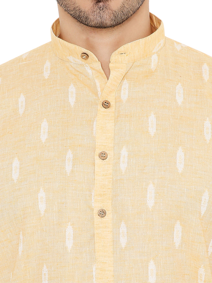 Close-up of yellow linen kurta collar and button placket, showcasing fine texture and breathable fabric for summer comfort.