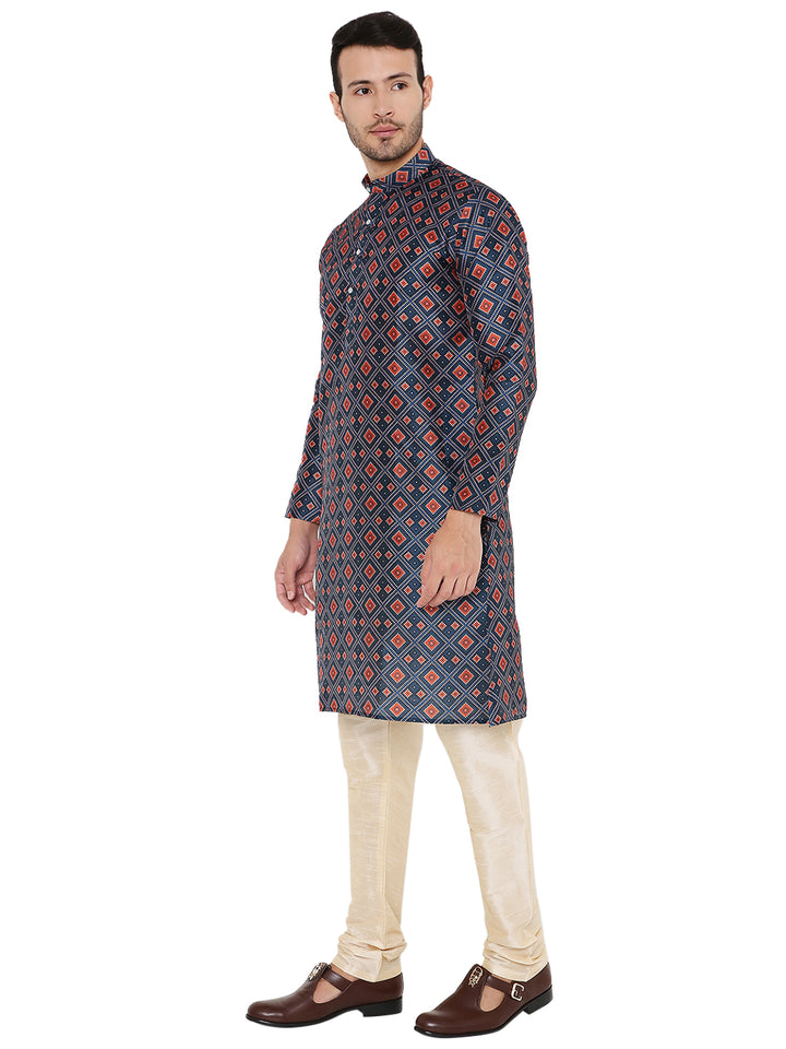 Traditional Indian Art Silk Embroidered Kurta in Dark Blue with red geometric motifs, styled with cream churidar pants, side view.