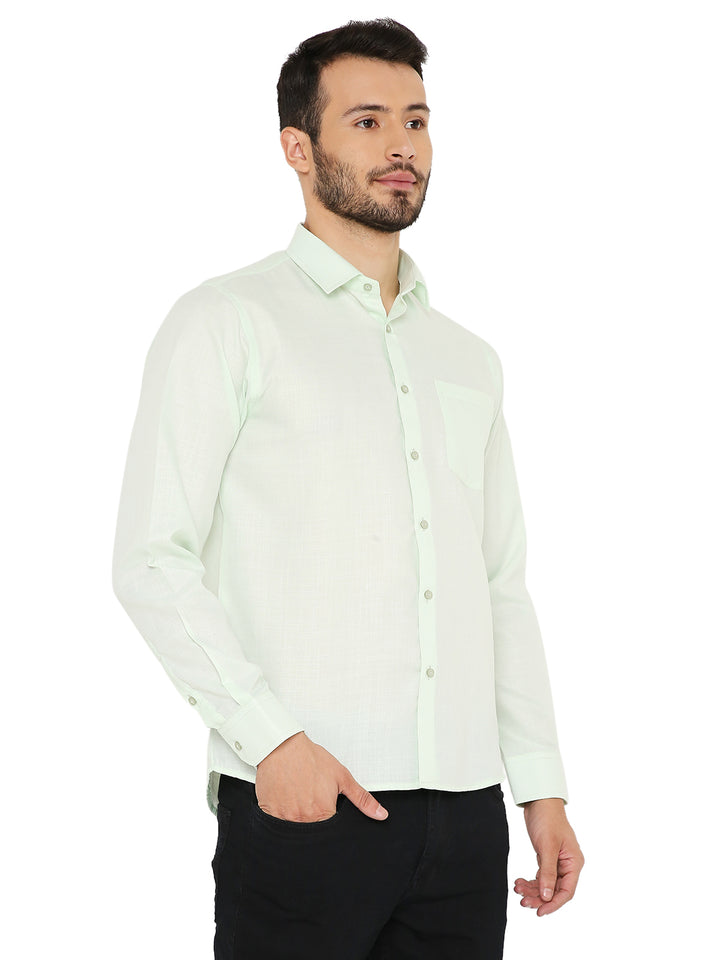 Men's Slim Fit Shirt in pastel green with solid pattern and front buttons, designed for comfort and everyday elegance.