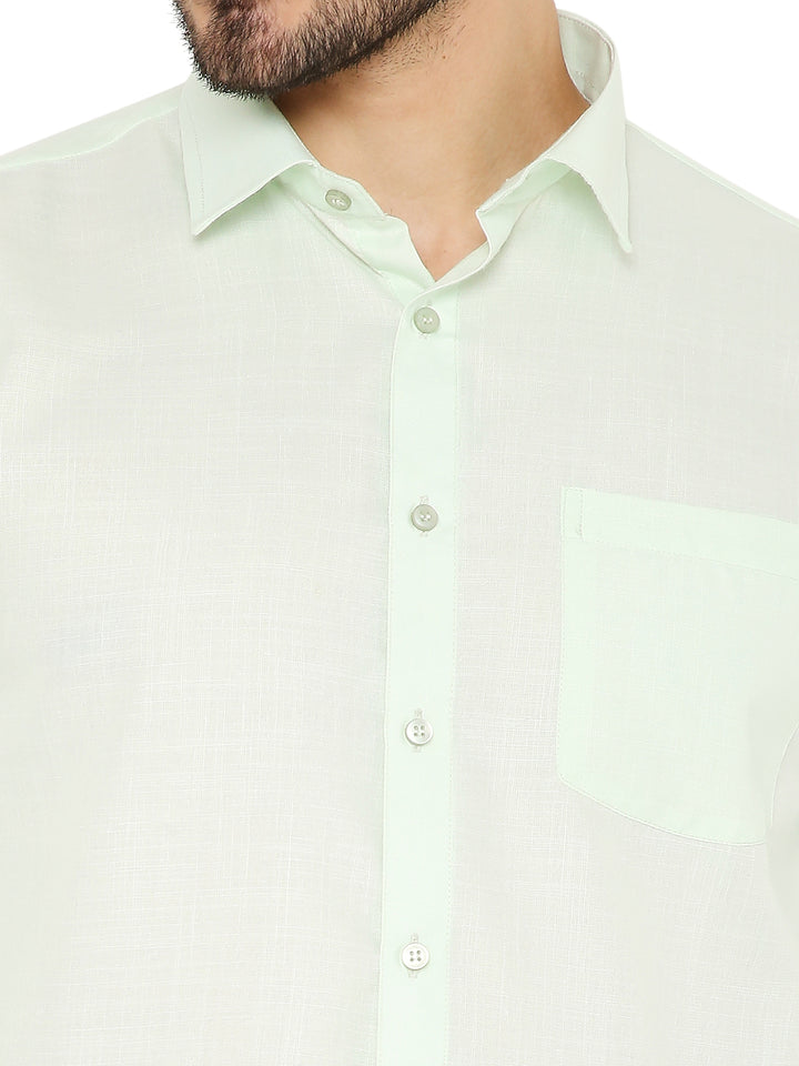 Close-up of Slim Fit Shirt - Pastel Green highlighting soft fabric texture, front pocket, and button details for refined finish.