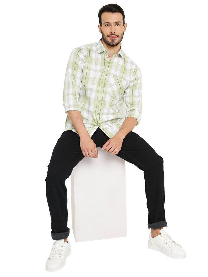 Model wearing Green Checkered Slim Fit Shirt styled with black jeans and white sneakers, perfect for a smart-casual outfit.