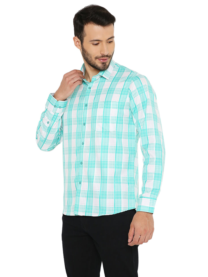 Men’s green checkered slim fit shirt styled with black pants, showcasing breathable fabric and tailored fit for all-day comfort.